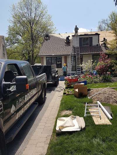 Roofing work in progress, truck nearby.