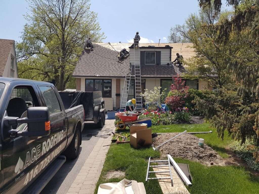 Roofing workers on residential house