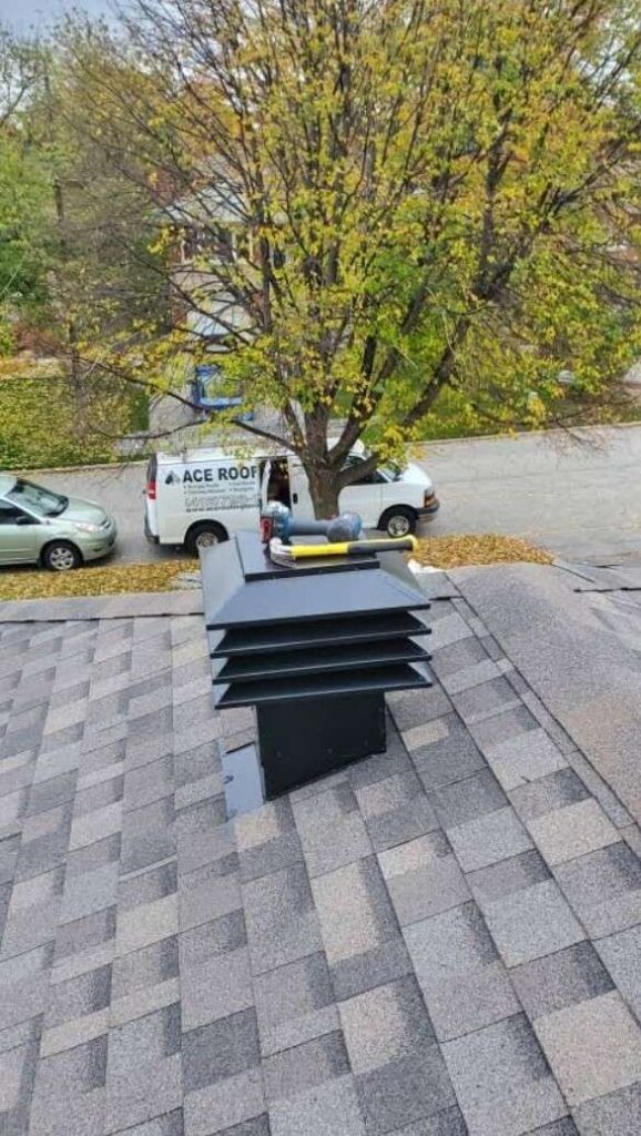 Roofing service truck near tree