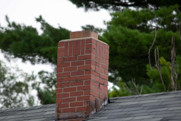Brick chimney on a sloped roof