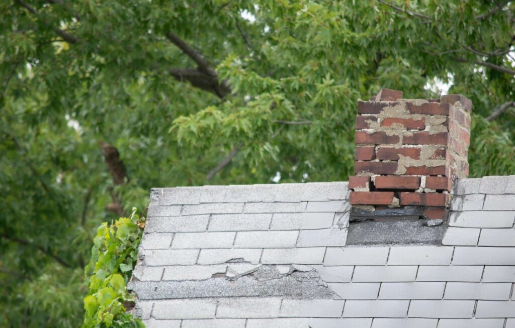 Chimney removal service toronto (3) Damaged chimney on a roof