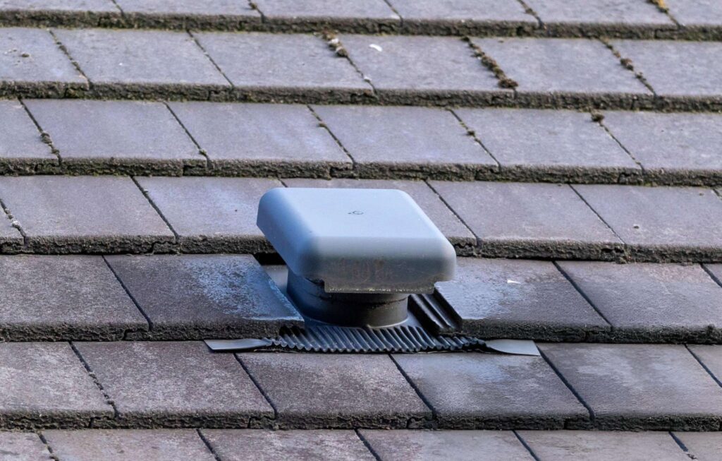 Roof vent on grey shingles