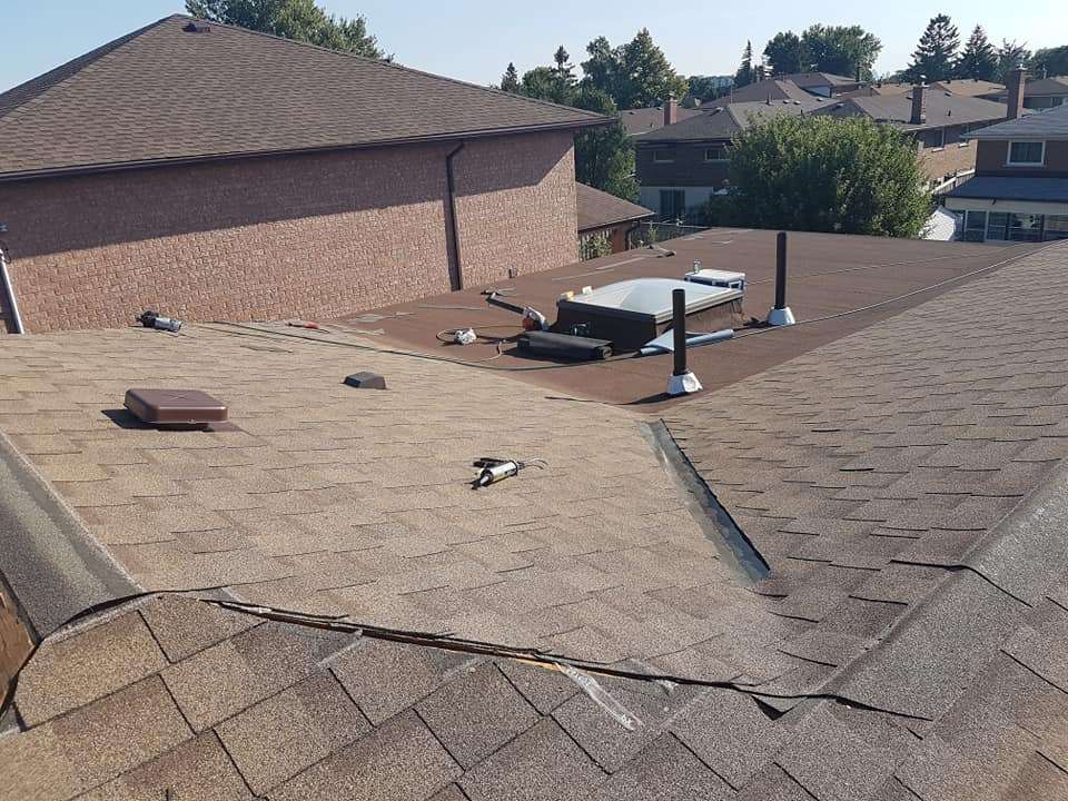Roof with skylight installation in progress
