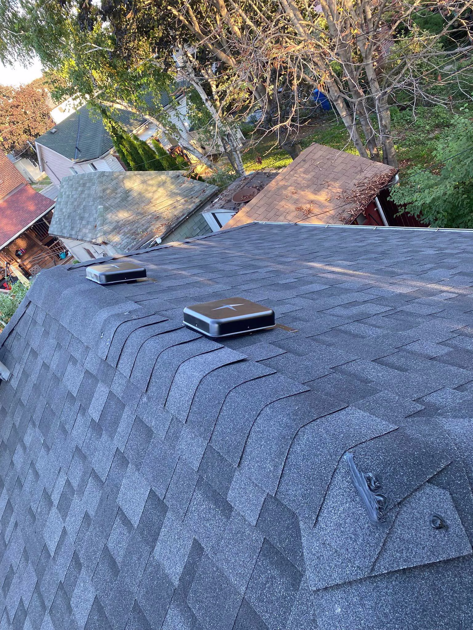 Complete shingle roof replacement with flashing and ventilation upgrades - 1